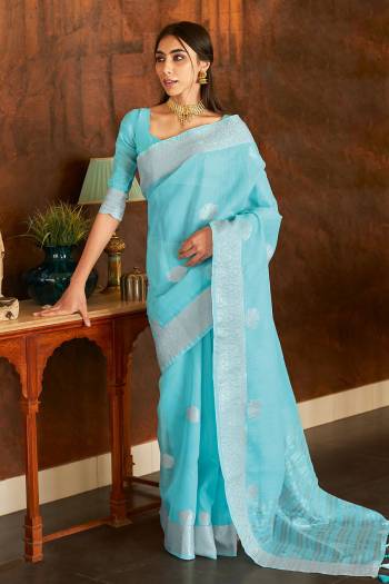 This Designer Partywear Saree Are Fine Saree Paired With Blouse.This Saree And Blouse Are Linen Based Fabric With Wevon Designer Work. Buy This Pretty Saree Now.