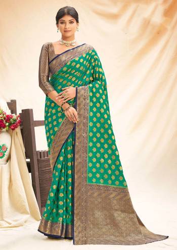 Garb This Designer Partywear Saree Are Fine Saree Paired With Blouse.This Saree And Blouse Are Silk Based Fabric With Wevon Designer Work. Buy This Pretty Saree Now.