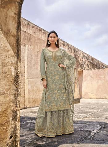 Looking This Designer Plazzo Suits In Lovely Color.Its Pretty Designer Wevon With Embroidery And Stone Work Top Is Dola Jacquard Based Paired Bottom Net With Net Fabricated Dupatta Which Gives An Attractive To The Dress.