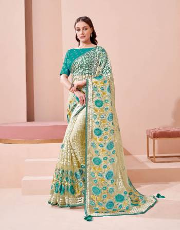 Garb This Partywear Stylist Designer Fine Colour Saree Paired With Blouse.This Saree Are Brosso And Blouse Are Raw Silk Fabric With Heavy Designer Embroidery Work. Buy This Pretty Saree Now.