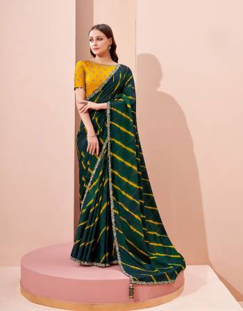 Garb This Partywear Stylist Designer Fine Colour Saree Paired With Blouse.This Saree Are Georgette And Blouse Are Raw Silk Fabric With Heavy Designer Embroidery Work. Buy This Pretty Saree Now.