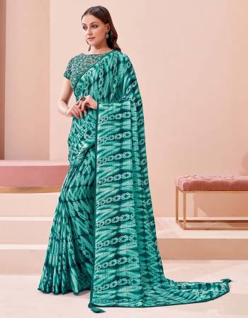 Garb This Partywear Stylist Designer Fine Colour Saree Paired With Blouse.This Saree Are Georgette And Blouse Are Raw Silk Fabric With Heavy Designer Embroidery Work. Buy This Pretty Saree Now.