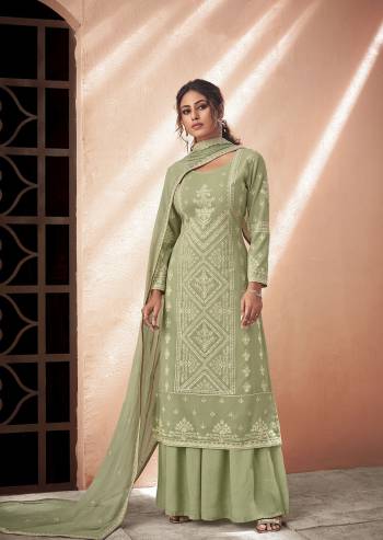 Fine Looking This Designer Long Length Suit In Lovely Color.Its Pretty Designer Lakhnavi Embroidery Work Top Is Muslin Based Paired With Santoon Bottom And Chiffon Fabricated Embroidery Dupatta Which Gives An Attractive To The Suit.