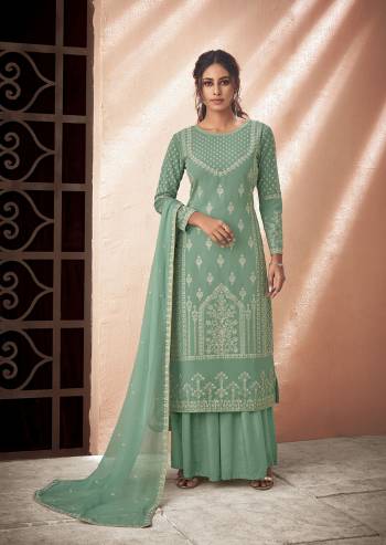 Fine Looking This Designer Long Length Suit In Lovely Color.Its Pretty Designer Lakhnavi Embroidery Work Top Is Muslin Based Paired With Santoon Bottom And Chiffon Fabricated Embroidery Dupatta Which Gives An Attractive To The Suit.