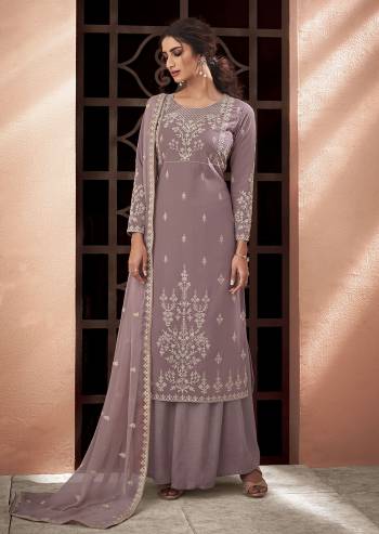 Fine Looking This Designer Long Length Suit In Lovely Color.Its Pretty Designer Lakhnavi Embroidery Work Top Is Muslin Based Paired With Santoon Bottom And Chiffon Fabricated Embroidery Dupatta Which Gives An Attractive To The Suit.