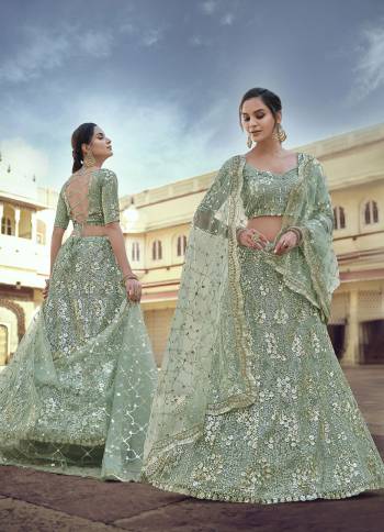 Garb This Partywear Heavy Designer Lehenga Choli In Fine Light Color Fabricated On Soft Net Beautified Fabric With Heavy Designer Sequance,Thread Embroidery And Stone Work.Buy Now. 