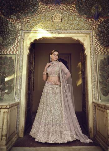 Garb This Partywear Heavy Designer Lehenga Choli In Fine Light Color Fabricated On Soft Net Beautified Fabric With Heavy Designer Sequance,Thread,Jari,Dori Embroidery Work.Buy Now. 