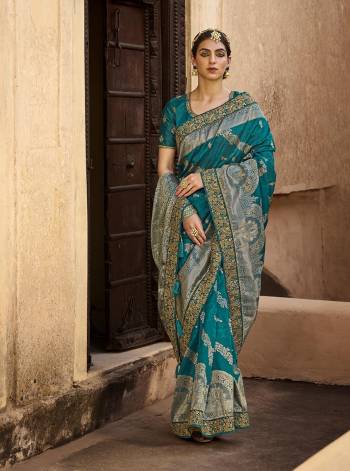 Garb This Partywear Stylist Designer Fine Colour Saree Paired With Blouse.This Wevon Designer With Embroidery Border Saree Are Silk And Blouse Are Raw Silk Fabric With Designer Embroidery Work. Buy This Pretty Saree Now.