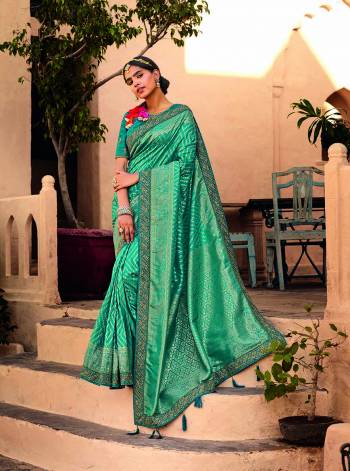 Garb This Partywear Stylist Designer Fine Colour Saree Paired With Blouse.This Wevon Designer With Embroidery Border Saree Are Silk And Blouse Are Raw Silk Fabric With Designer Embroidery Work. Buy This Pretty Saree Now.