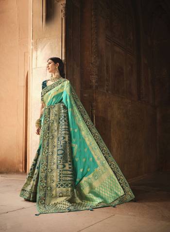Attrective Looking This Partywear Saree Are Fine Color Paired With Contrasted Blouse.This Saree Are Dola Silk And Blouse Are Banglori Silk Fabric With Heavy Designer Weaving With Border And Blouse Embroidery With Khatli Work. Buy This Pretty Saree Now.