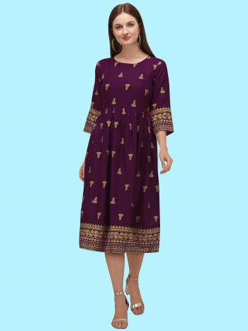 Grab This Readymade Long Kurti In Fine Color Fabricated On Rayon Beautified With Foil Prints. It Is Light In Weight And Easy To Carry All Day Long. 