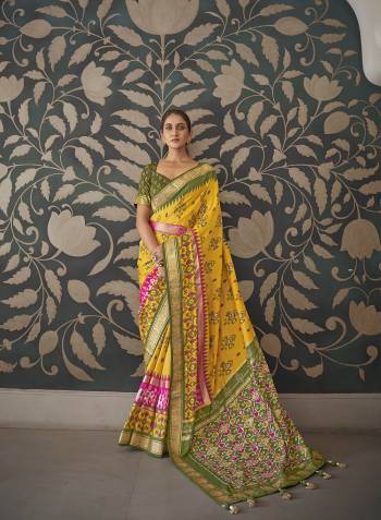 Capture the exuberance of womanhood in its full glory that will bring out your fragility and femininity. Women beauty is magnified tenfold in this alluring creame patola silk contemporary saree. The lovely weaving work throughout the attire is awe inspiring. Comes with Contrast blouse piece. 