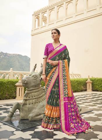 Capture the exuberance of womanhood in its full glory that will bring out your fragility and femininity. Women beauty is magnified tenfold in this alluring brown patola silk contemporary saree. The lovely weaving work throughout the attire is awe inspiring. Comes with Contrast blouse piece.