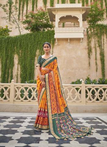 Capture the exuberance of womanhood in its full glory that will bring out your fragility and femininity. Women beauty is magnified tenfold in this alluring green patola silk contemporary saree. The lovely weaving work throughout the attire is awe inspiring. Comes with Contrast blouse piece.