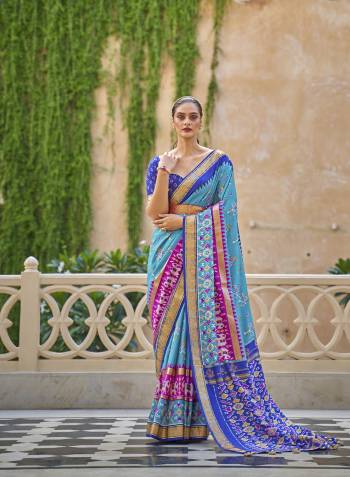 Capture the exuberance of womanhood in its full glory that will bring out your fragility and femininity. Women beauty is magnified tenfold in this alluring blue patola silk contemporary saree. The lovely weaving work throughout the attire is awe inspiring. Comes with Contrast blouse piece