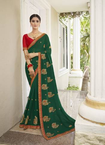 Celebrate This Wedding Season In This Very Pretty Colored Designer Embroidery Work Saree Paired With Contrasting Colored Blouse. This Saree Are Georgette and Blouse Are Silk Based Beautified With Detailed Embroidery. 