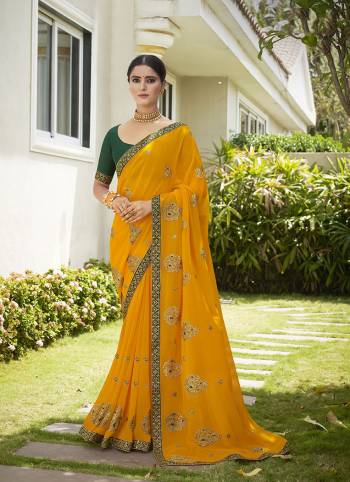 Celebrate This Wedding Season In This Very Pretty Colored Designer Embroidery Work Saree Paired With Contrasting Colored Blouse. This Saree Are Georgette and Blouse Are Silk Based Beautified With Detailed Embroidery. 