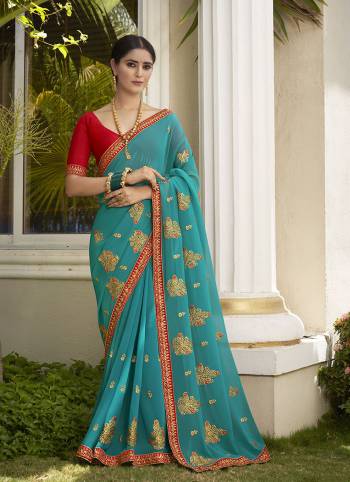 Celebrate This Wedding Season In This Very Pretty Colored Designer Embroidery Work Saree Paired With Contrasting Colored Blouse. This Saree Are Georgette and Blouse Are Silk Based Beautified With Detailed Embroidery. 