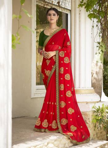 Celebrate This Wedding Season In This Very Pretty Colored Designer Embroidery Work Saree Paired With Contrasting Colored Blouse. This Saree Are Georgette and Blouse Are Silk Based Beautified With Detailed Embroidery. 