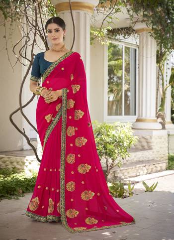 Celebrate This Wedding Season In This Very Pretty Colored Designer Embroidery Work Saree Paired With Contrasting Colored Blouse. This Saree Are Georgette and Blouse Are Silk Based Beautified With Detailed Embroidery. 