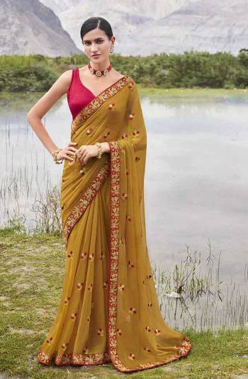 Look Attractive Wearing This Fine Colored Saree Paired With Contrasted Colored Blouse.  This Heavy Designer Butti Embroidey Work Saree Is Chiffon Based Which Gives A Rich Look To Your Personality. Buy This Pretty Saree Now.