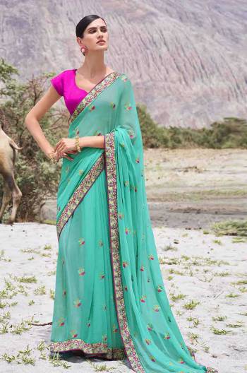 Look Attractive Wearing This Fine Colored Saree Paired With Contrasted Colored Blouse.  This Heavy Designer Butti Embroidey Work Saree Is Chiffon Based Which Gives A Rich Look To Your Personality. Buy This Pretty Saree Now.