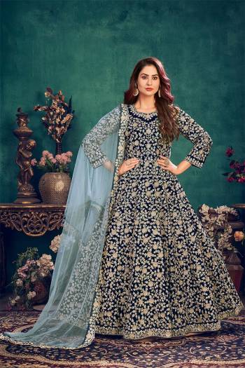 Attrective This Partywear Designer Long Length Suit In Dark Color.Its Pretty Heavy Designer Full Embroidery Work Top Is Velvet Based Paired With Santoon Bottom And Net  Fabricated Dupatta Which Gives An Attractive To The Suit.