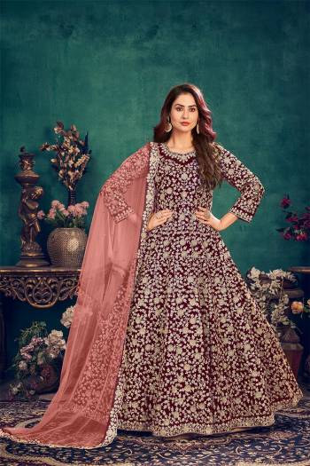 Attrective This Partywear Designer Long Length Suit In Dark Color.Its Pretty Heavy Designer Full Embroidery Work Top Is Velvet Based Paired With Santoon Bottom And Net  Fabricated Dupatta Which Gives An Attractive To The Suit.