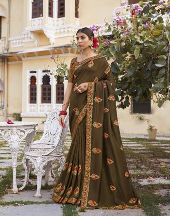 Grab This Pretty Elegant Looking Designer Saree In Fine Color Paired With Blouse. This Saree Are Vichitra Silk And Blouse Are Silk Jacquard Based Beautified With Embroidery Work. Buy Now.