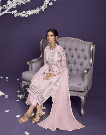 Attrective This Designer Long Length Suit In Lovely Light Color.Its Pretty Heavy Designer Thread,Jari,Sequance Embroidery Work Top Is Georgette Based Paired With Dull Santoon Bottom And Net Fabricated Dupatta Which Gives An Attractive To The Suit.