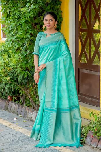 Classic Designer Partywear Saree Are Fine Color Paired With Blouse.This Saree And Blouse Are South Cotton Based Fabric With Heavy Wevon Jari And Temple Pallu Border Tassels Designer. Buy This Pretty Saree Now.