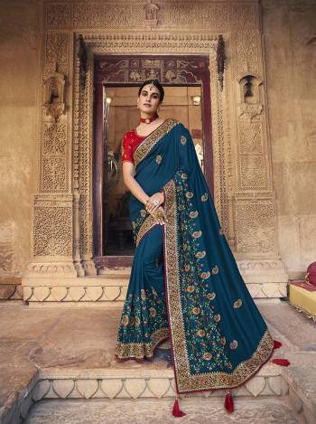 Garb This Pretty Angelic Patan Wearing This Heavy Designer Embroidery Work Saree In Fine Color Paired With Blouse. This Saree Satin Georgette And Blouse Is Fabricated on Art Silk Paired. Its Attractive Look To Your Personality. 