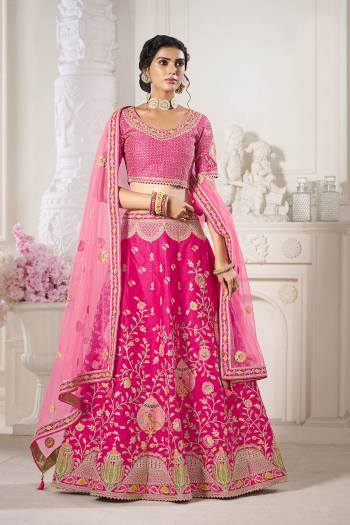 Garb This Bridal Heavy Designer Lehenga Choli In Fine lovely Color Fabricated On Choli Raw Silk Beautified Fabric Lahenga Are Silk With Heavy Designer Thread,Jari,Dori Embroidery And Khatli Work.Buy Now. 