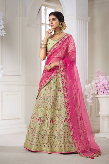 Garb This Bridal Heavy Designer Lehenga Choli In Fine lovely Color Fabricated On Choli Raw Silk Beautified Fabric Lahenga Are Silk With Heavy Designer Thread,Jari,Dori Embroidery And Khatli Work.Buy Now. 