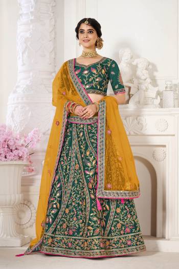 Garb This Bridal Heavy Designer Lehenga Choli In Fine lovely Color Fabricated On Choli Raw Silk Beautified Fabric Lahenga Are Silk With Heavy Designer Thread,Jari,Dori Embroidery And Khatli Work.Buy Now. 