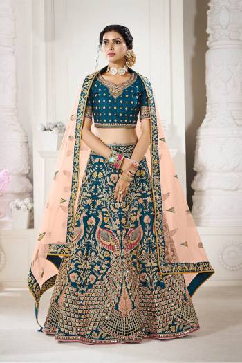 Garb This Bridal Heavy Designer Lehenga Choli In Fine lovely Color Fabricated On Choli Raw Silk Beautified Fabric Lahenga Are Silk With Heavy Designer Thread,Jari,Dori Embroidery And Khatli Work.Buy Now. 