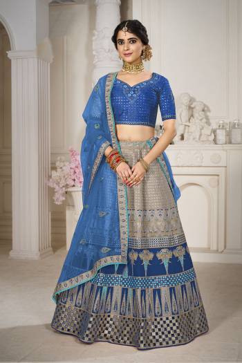 Garb This Bridal Heavy Designer Lehenga Choli In Fine lovely Color Fabricated On Choli Raw Silk Beautified Fabric Lahenga Are Silk With Heavy Designer Thread,Jari,Dori Embroidery And Khatli Work.Buy Now. 