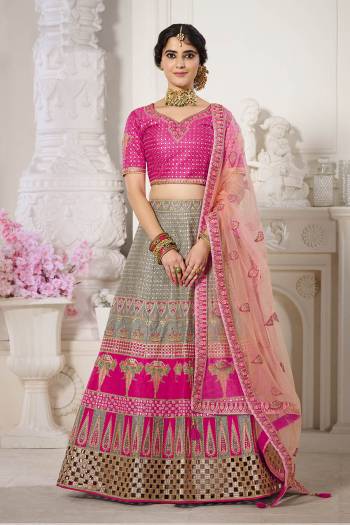 Garb This Bridal Heavy Designer Lehenga Choli In Fine lovely Color Fabricated On Choli Raw Silk Beautified Fabric Lahenga Are Silk With Heavy Designer Thread,Jari,Dori Embroidery And Khatli Work.Buy Now. 