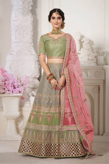 Garb This Bridal Heavy Designer Lehenga Choli In Fine lovely Color Fabricated On Choli Raw Silk Beautified Fabric Lahenga Are Silk With Heavy Designer Thread,Jari,Dori Embroidery And Khatli Work.Buy Now. 