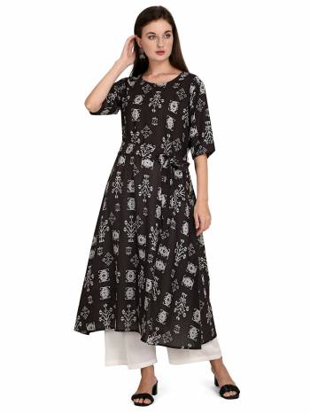 Attrective This Readymade Long Kurti With Bottom In Fine Color Fabricated On Rayon Beautified With Designer Printed. It Is Light In Weight And Easy To Carry All Day Long. 