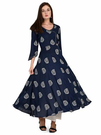 Attrective This Readymade Long Kurti With Bottom In Fine Color Fabricated On Rayon Beautified With Designer Printed. It Is Light In Weight And Easy To Carry All Day Long. 