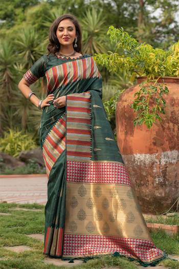 Garb This Designer Partywear Saree Are Fine Saree Paired With Blouse.This Saree And Blouse Are Tussar Silk Based Fabric With Wevon Designer Palu Border Work. Buy This Pretty Saree Now.