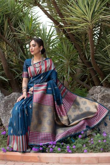 Garb This Designer Partywear Saree Are Fine Saree Paired With Blouse.This Saree And Blouse Are Tussar Silk Based Fabric With Wevon Designer Palu Border Work. Buy This Pretty Saree Now.