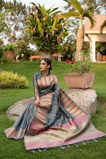 Garb This Designer Partywear Saree Are Fine Saree Paired With Blouse.This Saree And Blouse Are Tussar Silk Based Fabric With Wevon Designer Palu Border Work. Buy This Pretty Saree Now.