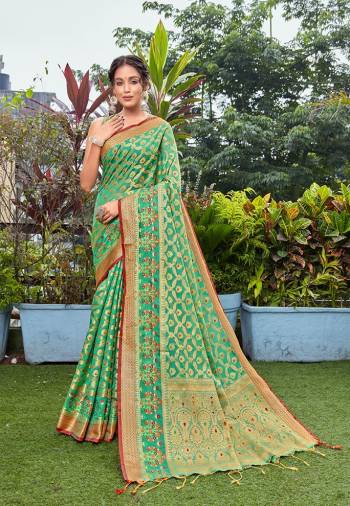 Attrective This Designer Saree Are Fine Saree Paired With Blouse.This Saree Are Banarasi Silk And Blouse Are Art Silk Based Fabric With Designer Wevon. Buy This Pretty Saree Now.