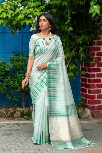 Classic Designer Partywear Saree Are Fine Saree Paired With Blouse.This Saree And Blouse Are Tussar Silk Based Fabric With Heavy Wevon ,ikkat Border,Pallu Tassels Designer. Buy This Pretty Saree Now.