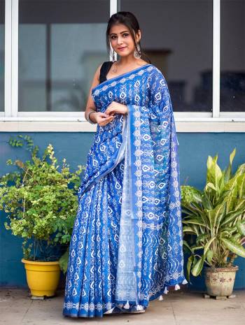 Garb This Designer Saree Are Fine Saree Paired With Blouse.This Saree And Blouse Are Soft Cotton Based Fabric With Designer Batik Printed With Jari Lining Border. Buy This Pretty Saree Now.