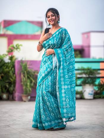 Garb This Designer Saree Are Fine Saree Paired With Blouse.This Saree And Blouse Are Soft Cotton Based Fabric With Designer Batik Printed With Jari Lining Border. Buy This Pretty Saree Now.