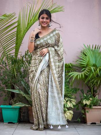 Garb This Designer Saree Are Fine Saree Paired With Blouse.This Saree And Blouse Are Soft Cotton Based Fabric With Designer Batik Printed With Jari Lining Border. Buy This Pretty Saree Now.