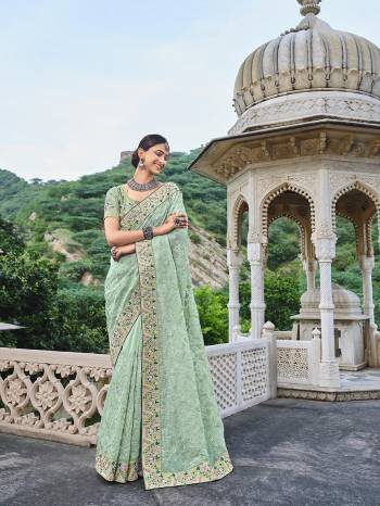 Attrective Looking This Partywear Saree Are Fine Color Paired With Contrasted Blouse.This Saree Are Organza And Blouse Are Silk Fabric With Heavy Designer Kachhi Mirror Embroidery With Diamond Work. Buy This Pretty Saree Now.